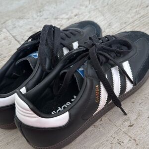 Selling these cool black sambas! Fits a woman’s 7 1/2! So cool and chic.